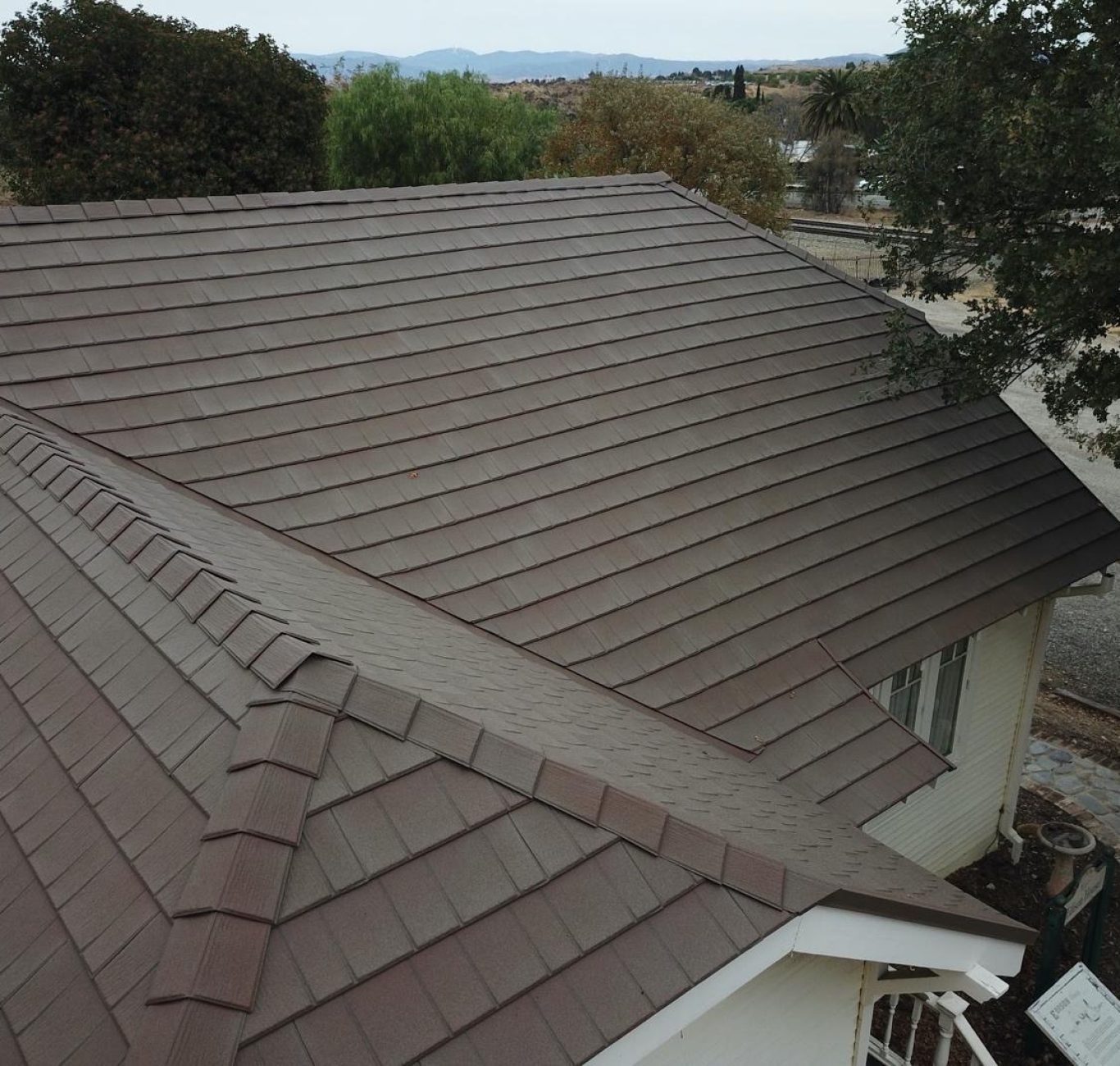 Kutsch Roofing team working on hail-damaged roof