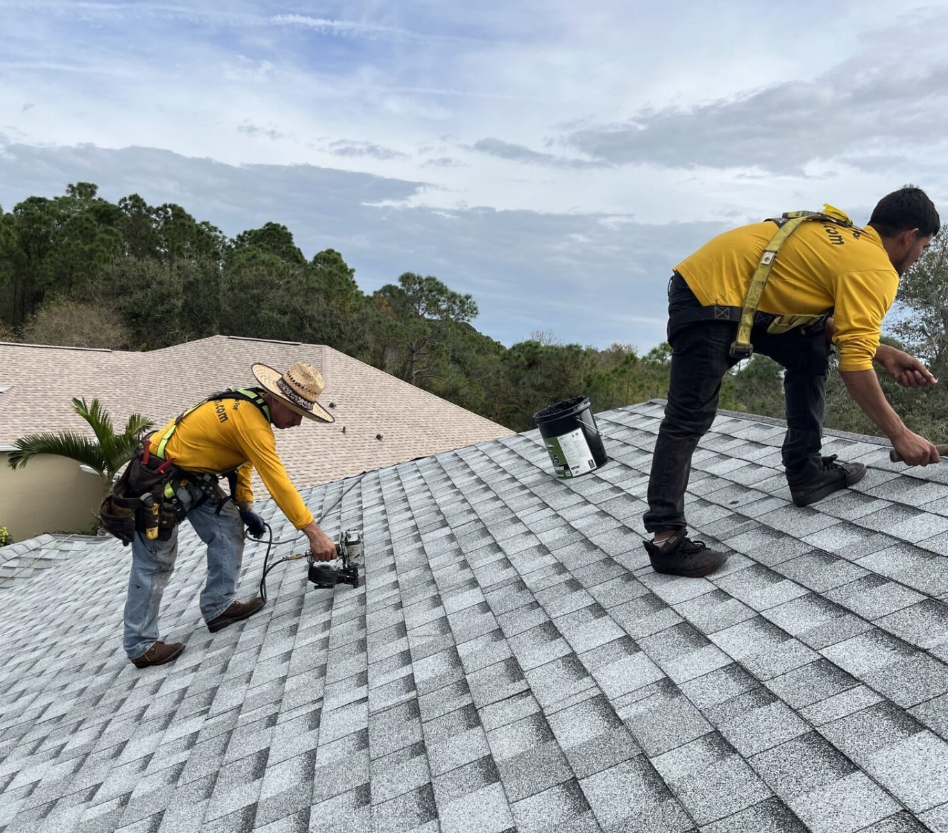Technician replacing damaged shingles on Nebraska home