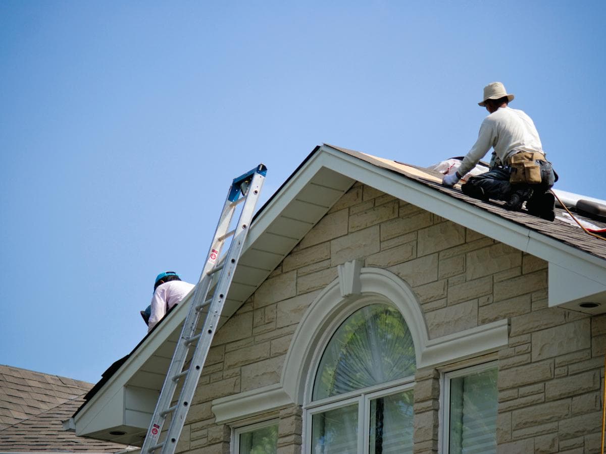 Repairing wind-lifted shingles on a Columbus, NE roof