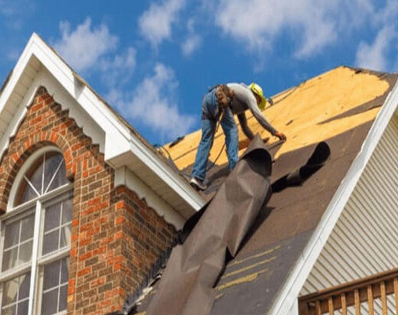 Crew inspecting a Grand Island, Nebraska roof after a hailstorm