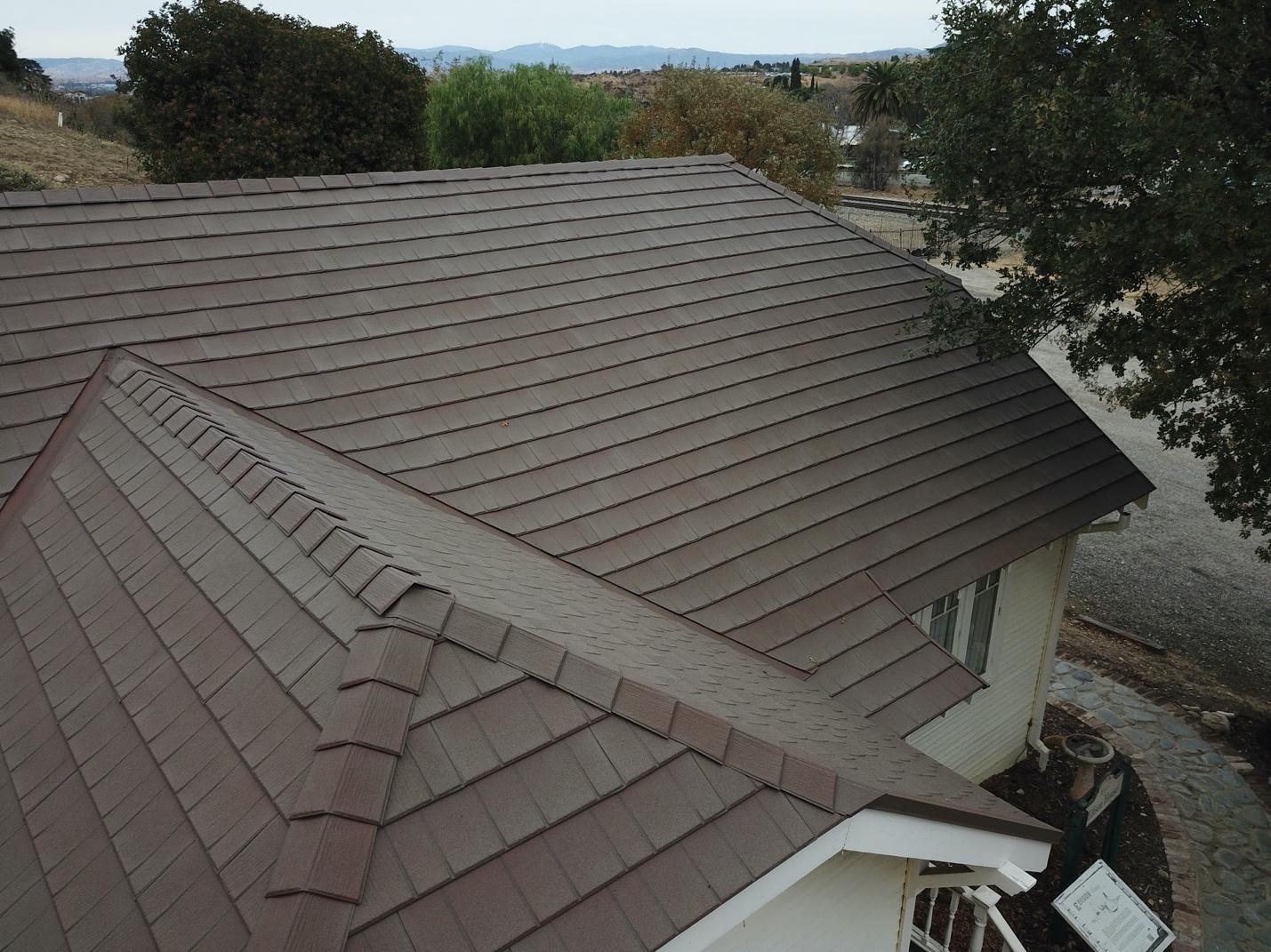 Kutsch Roofing team working on hail-damaged roof